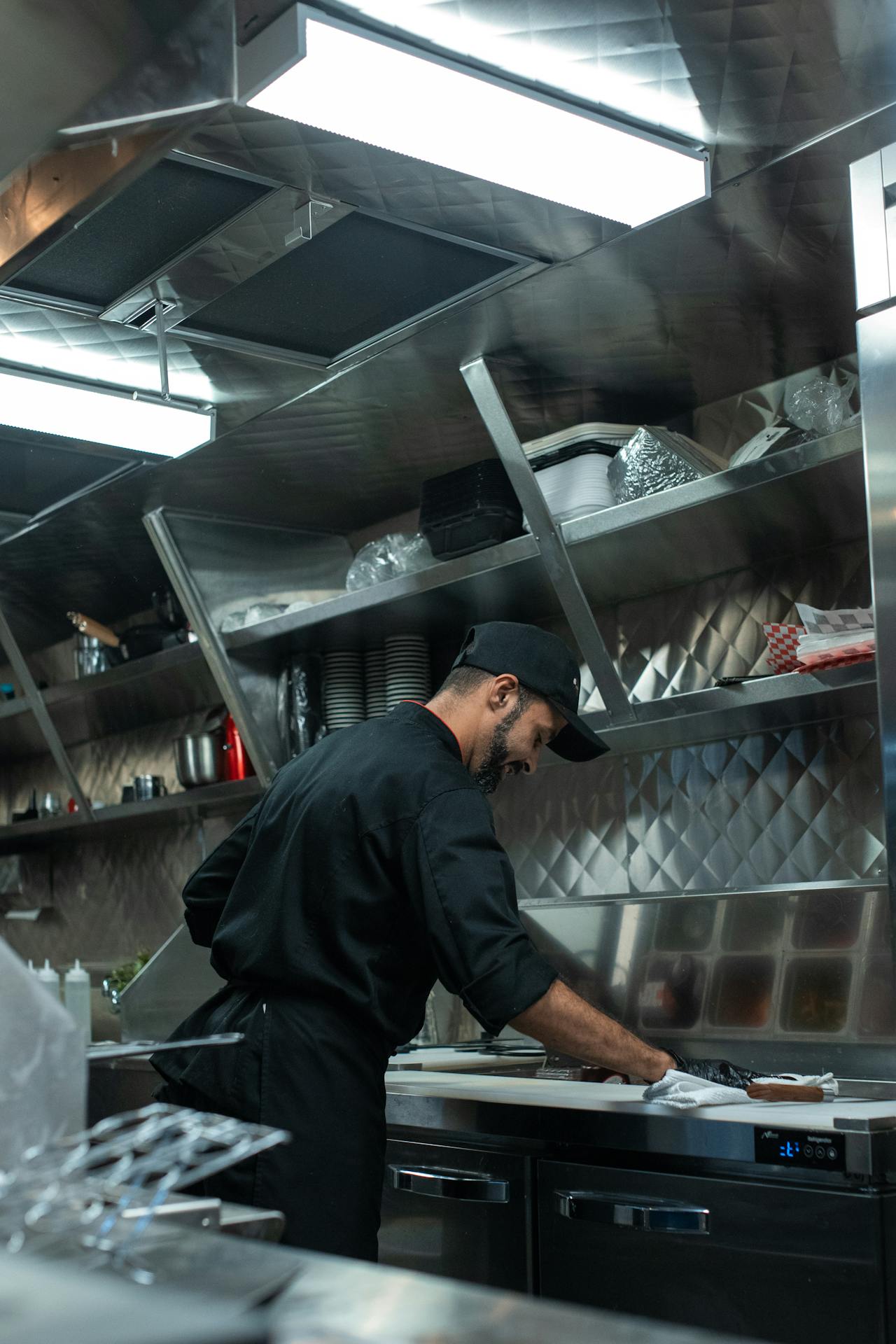 Licensed grease trap technician maintaining commercial kitchen Toledo OH